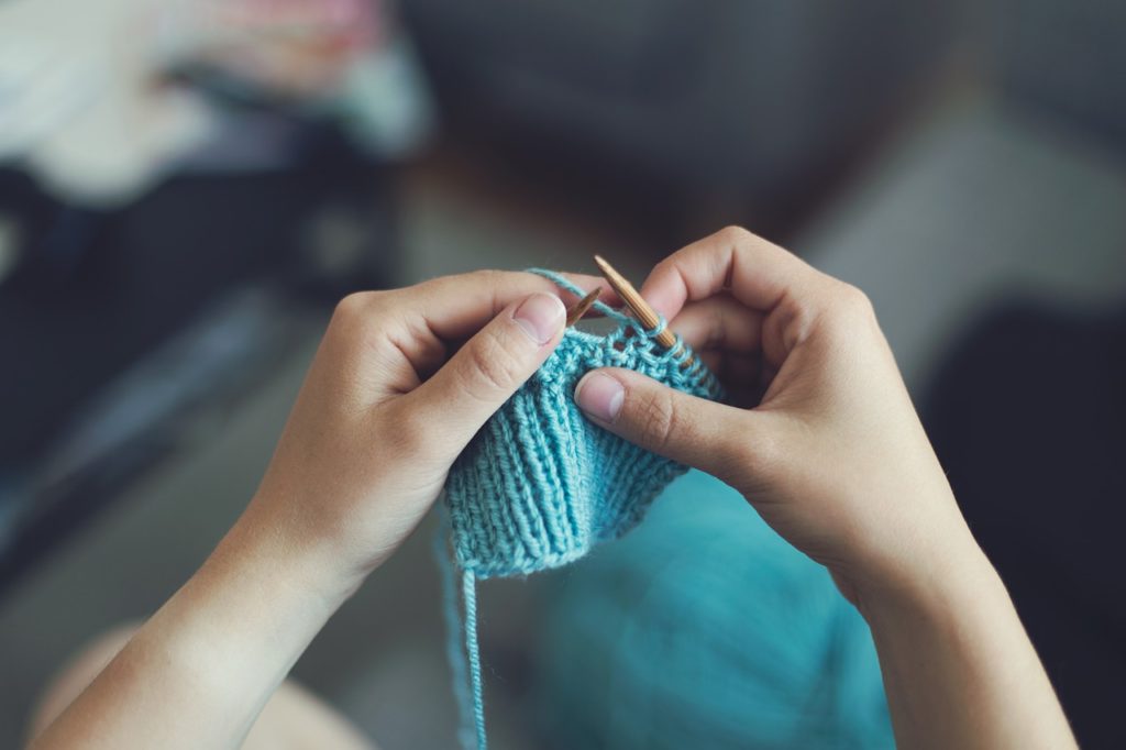 Person's hands knitting