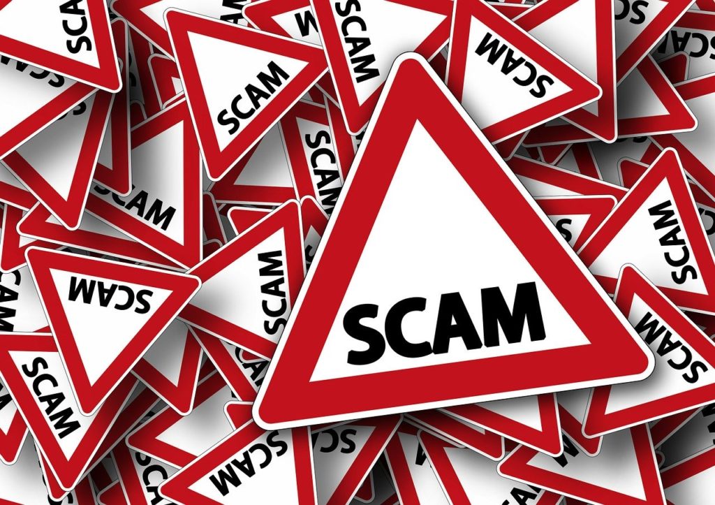 Scam alert road sign Scam alert road sign